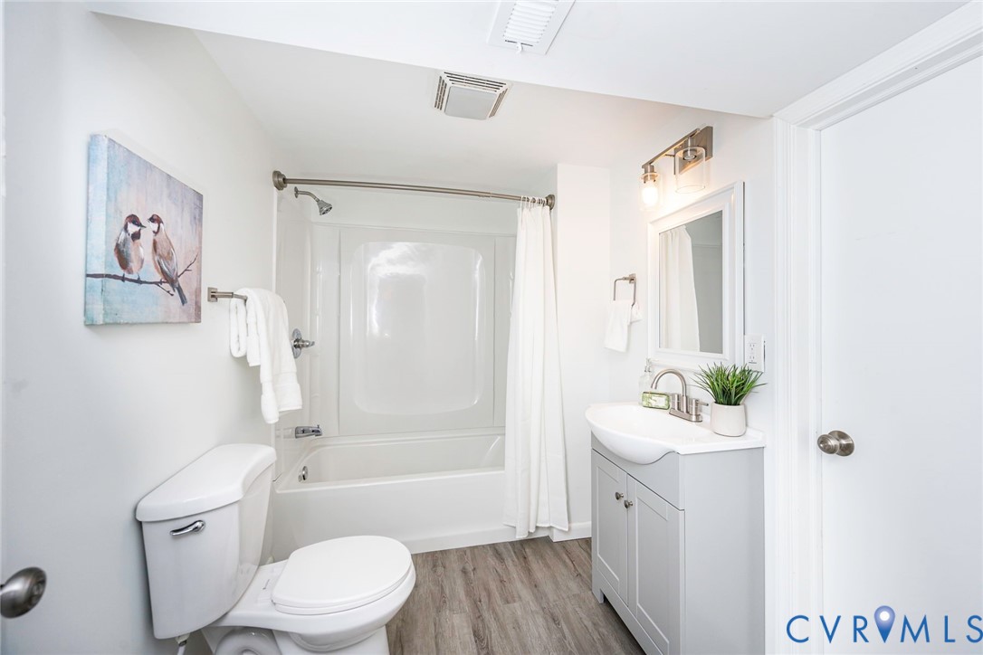 9406 Kendrick Road Chesterfield, VA 23236 - Photo 14 of 15 Modern vanity with a curved basin sink, brushed ni