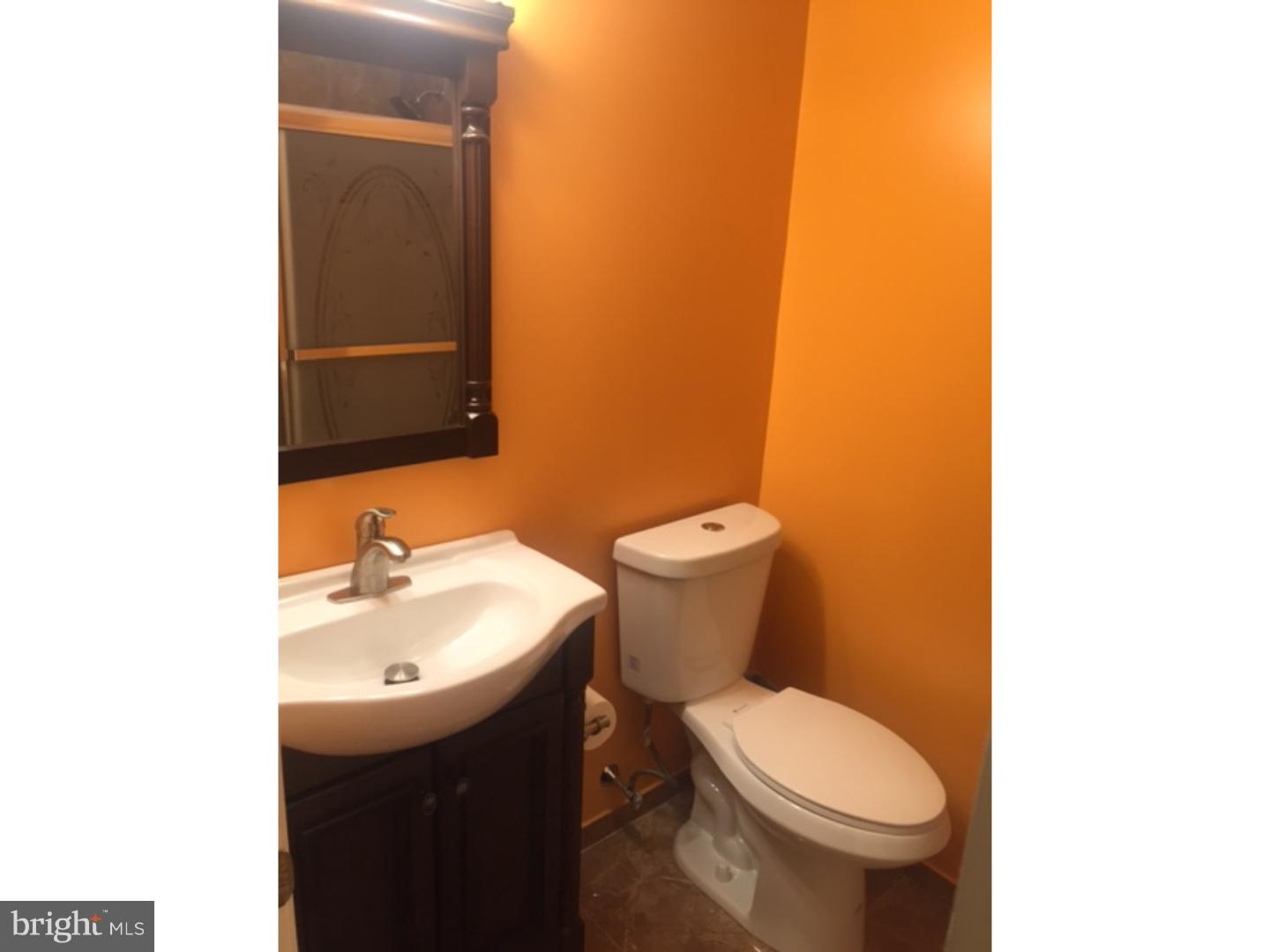 9708 Glenhope Road Philadelphia, PA 19115 - Photo 13 of 25 a bathroom with a sink and a toilet