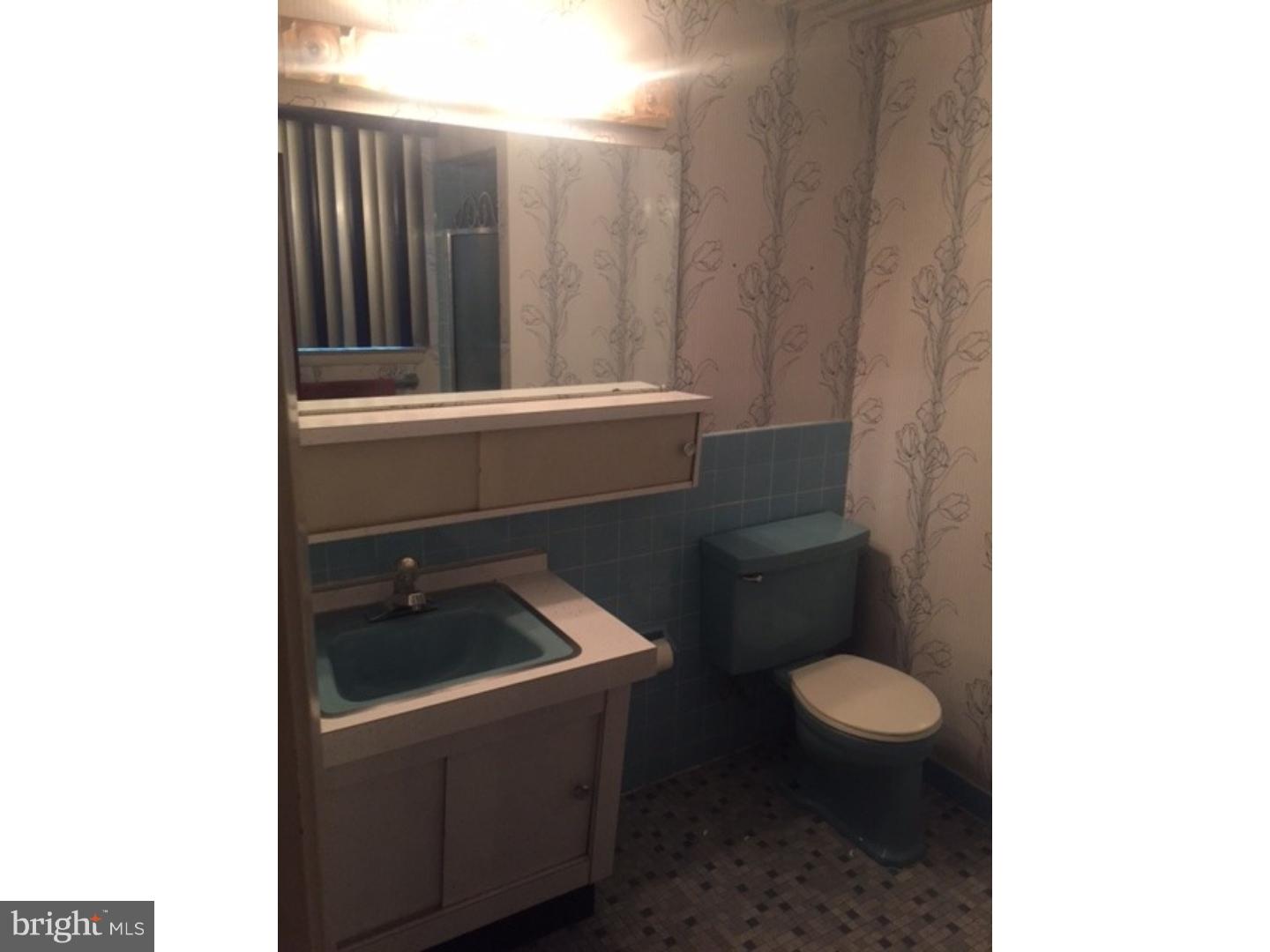 9708 Glenhope Road Philadelphia, PA 19115 - Photo 16 of 25 a bathroom with a sink and a toilet
