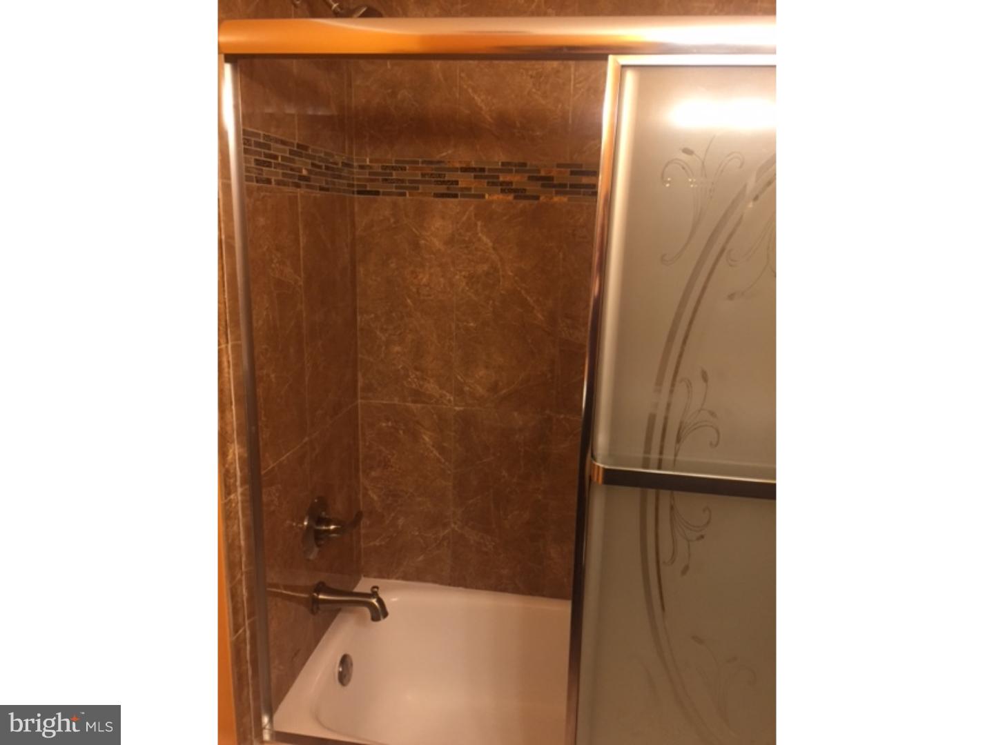 9708 Glenhope Road Philadelphia, PA 19115 - Photo 18 of 25 a bathroom with a shower
