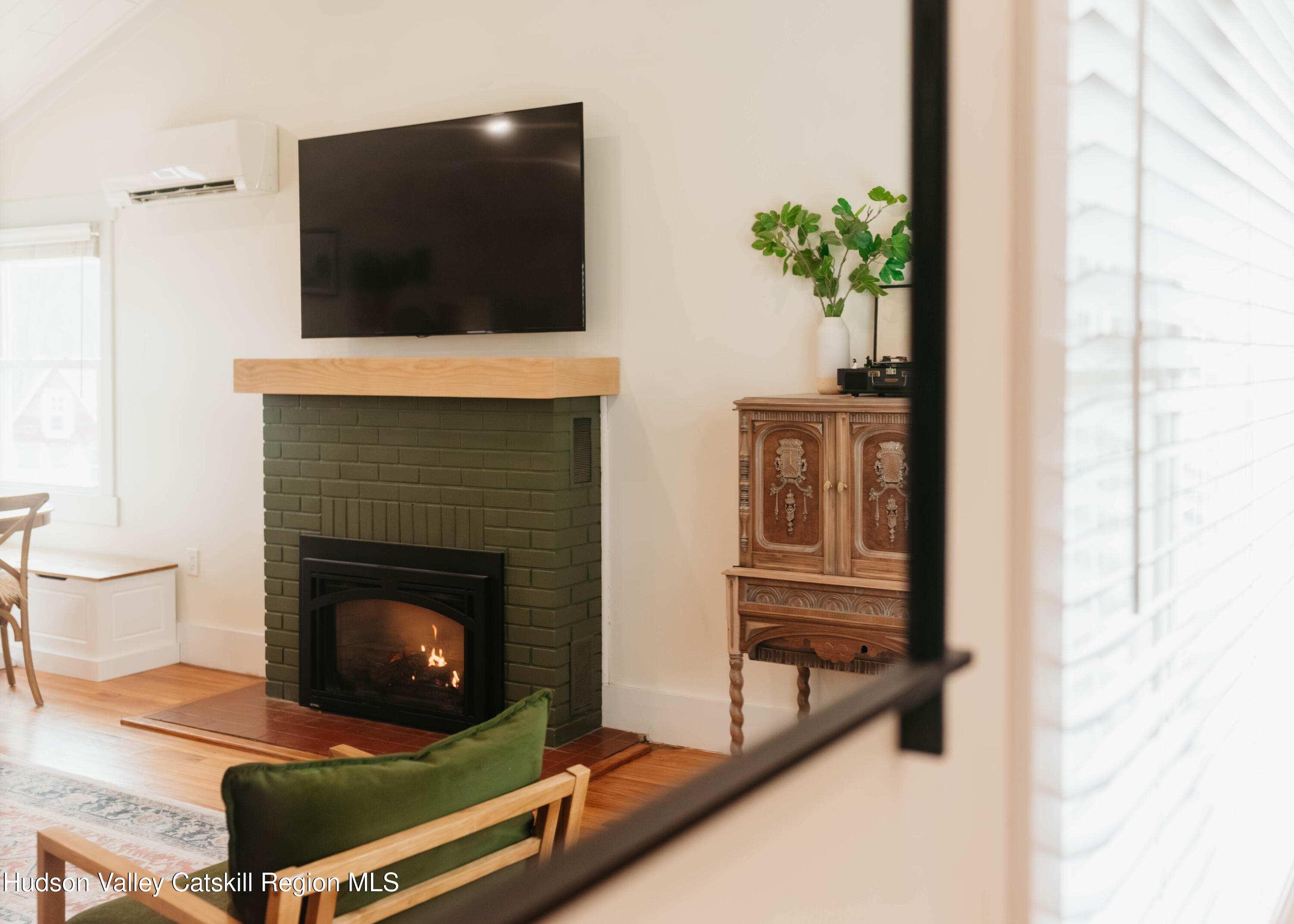 489 Forest Road Wallkill, NY 12589 - Photo 15 of 32 a living room with a flat screen tv and a fireplace