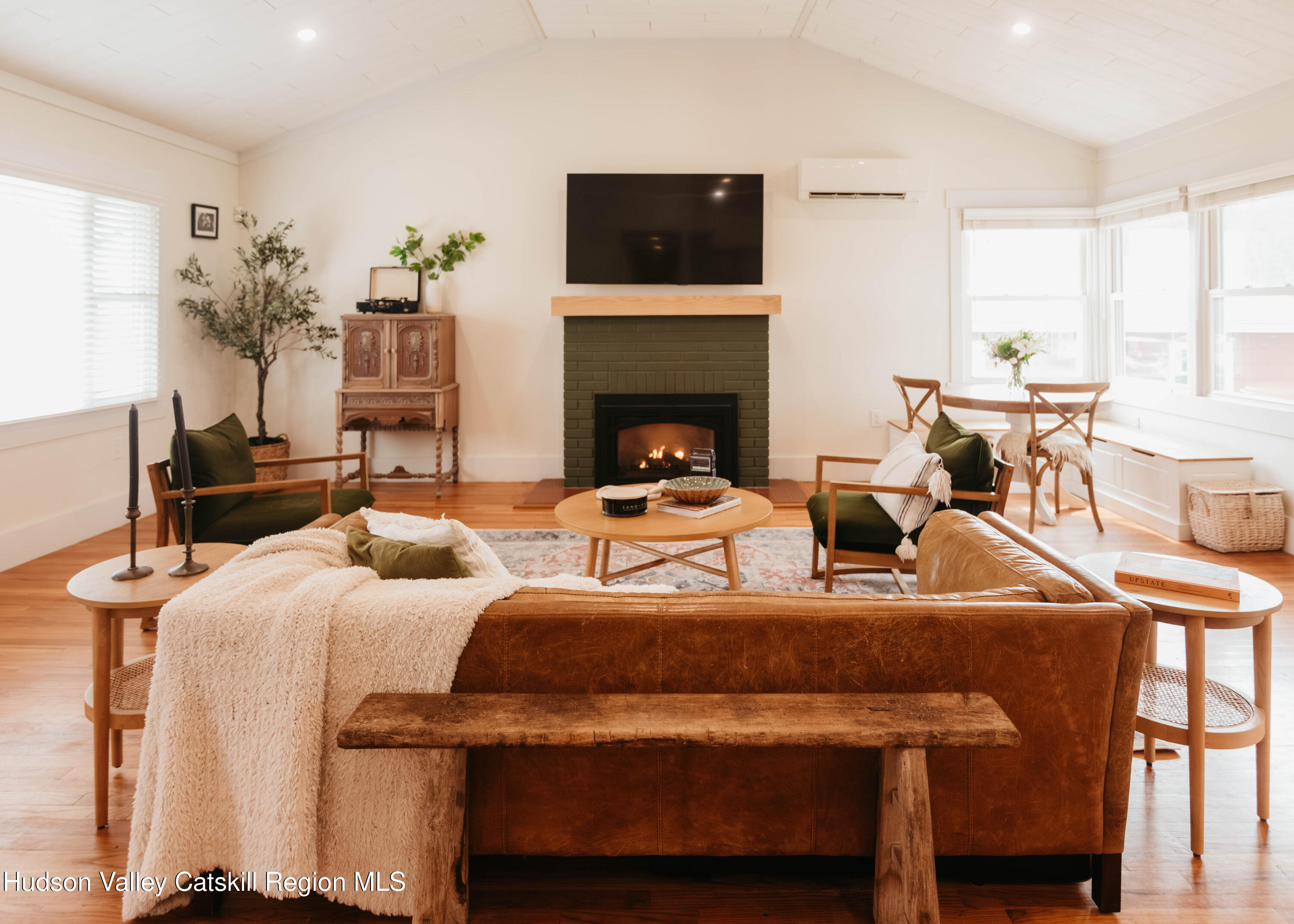 489 Forest Road Wallkill, NY 12589 - Photo 3 of 32 a living room with furniture a flat screen tv and a fireplace
