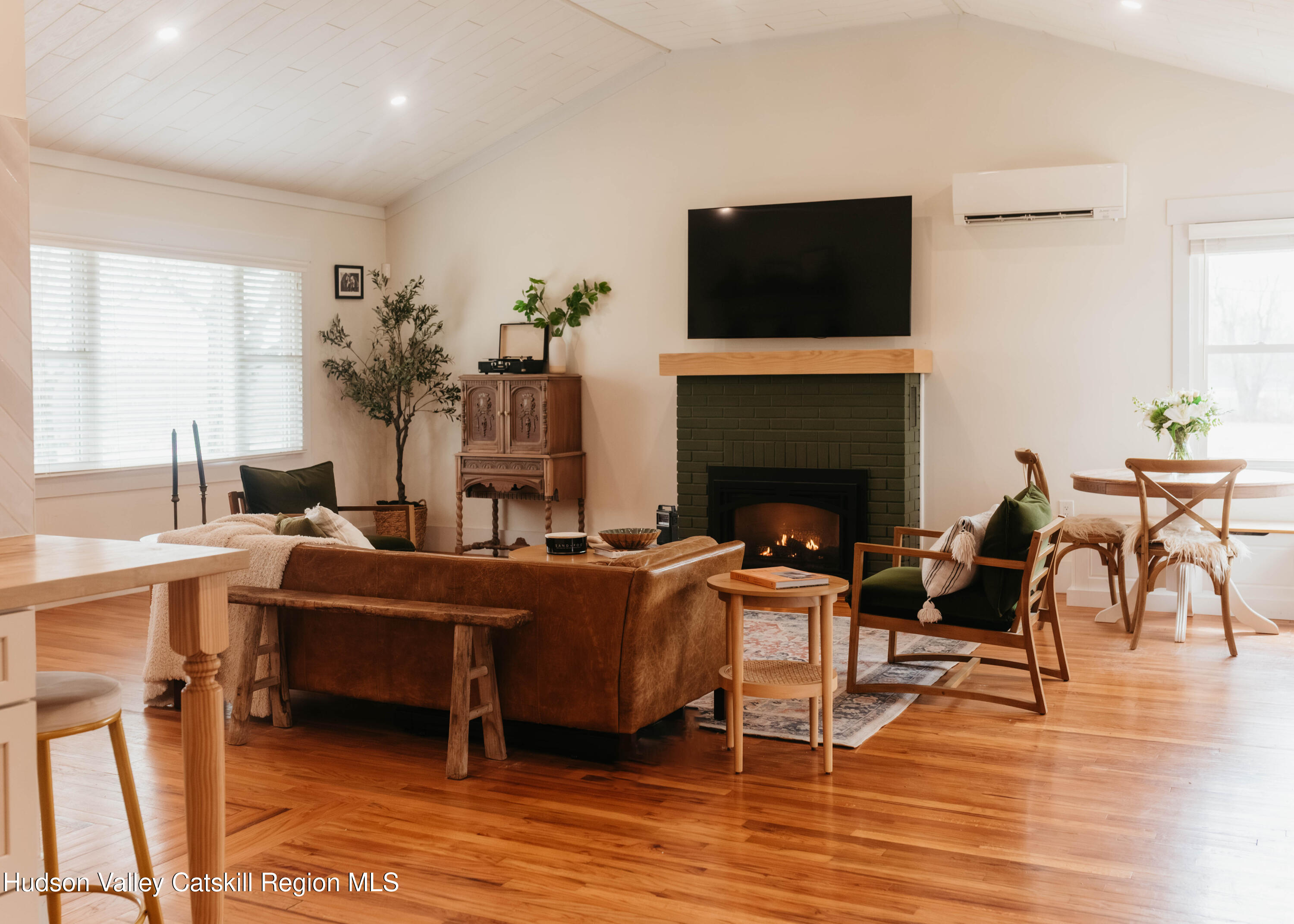 489 Forest Road Wallkill, NY 12589 - Photo 6 of 32 a living room with furniture a fireplace and a flat screen tv