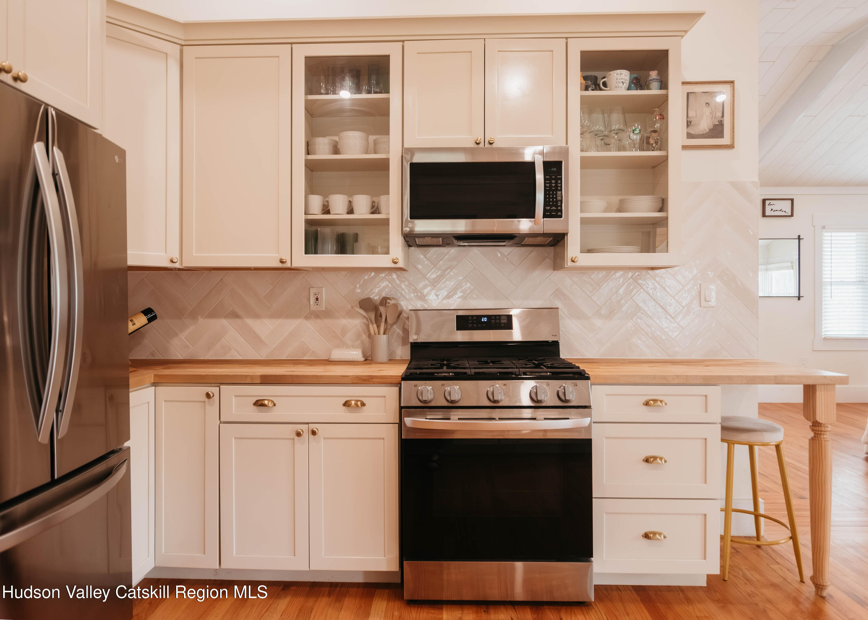 489 Forest Road Wallkill, NY 12589 - Photo 8 of 32 a kitchen with stainless steel appliances white cabinets and a stove top oven