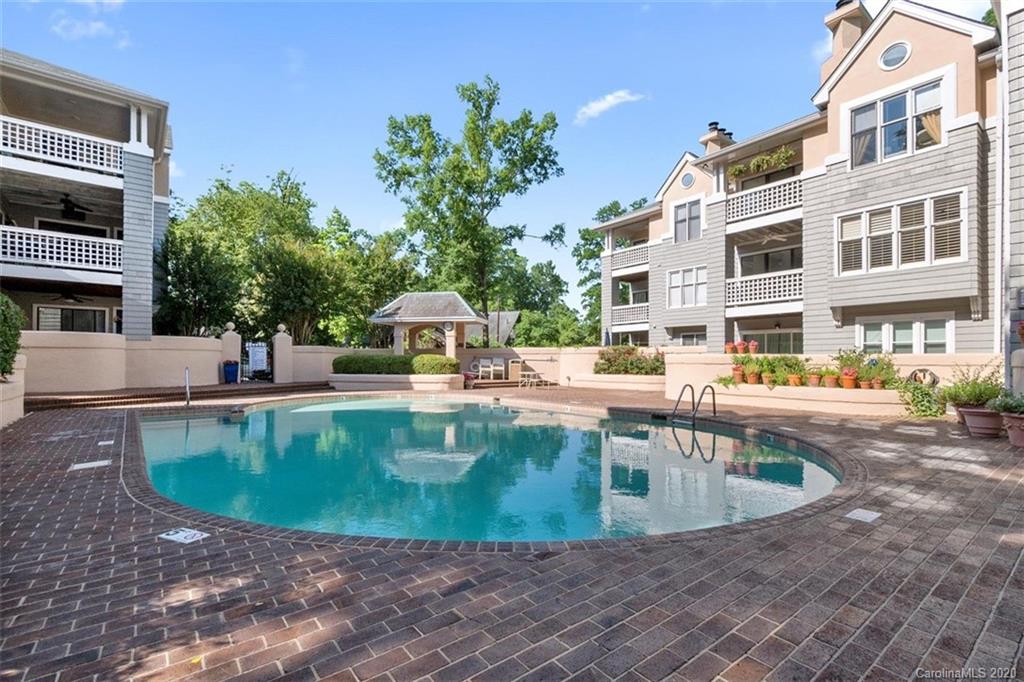 a view of a swimming pool with a patio