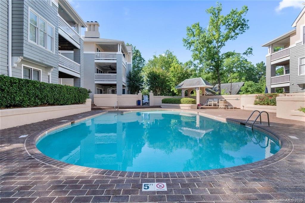 232 Queens Road, Unit 39 Charlotte, NC 28204 - Photo 2 of 29 a view of a swimming pool with a patio