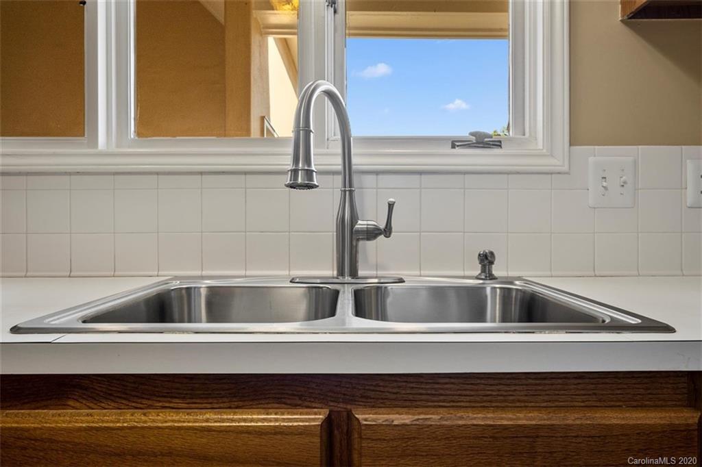 232 Queens Road, Unit 39 Charlotte, NC 28204 - Photo 11 of 29 a close view of sink and tap