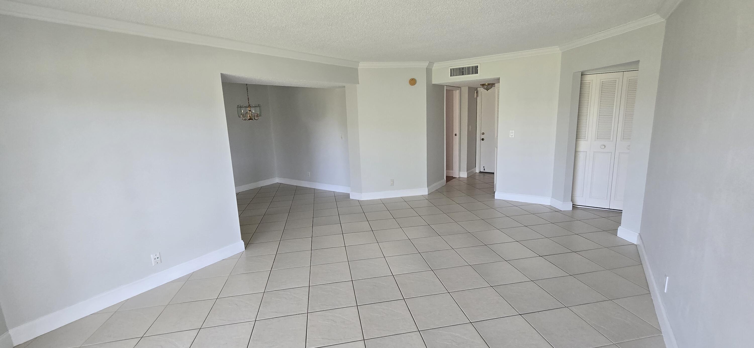 3661 Via Poinciana, Unit 306 Lake Worth, FL 33467 - Photo 2 of 13 a view of an empty room