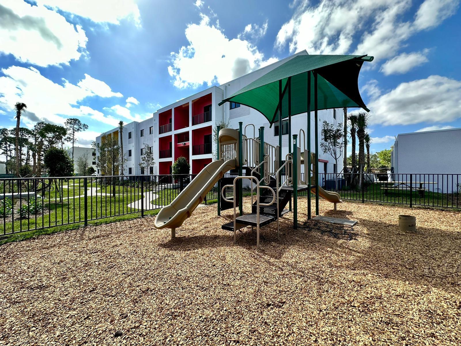 4290 Lakewood Road, Unit 101 Lake Worth, FL 33461 - Photo 12 of 13 a view of a park with a slide