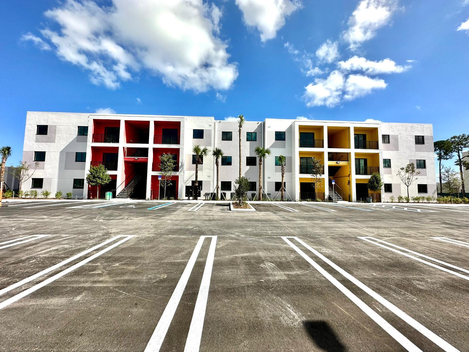 4290 Lakewood Road, Unit 101 Lake Worth, FL 33461 - Photo 13 of 13 a view of a building with a outdoor space