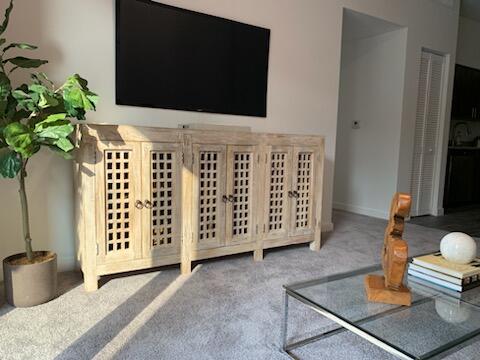 4290 Lakewood Road, Unit 101 Lake Worth, FL 33461 - Photo 5 of 13 a view of living room with furniture and a flat screen tv