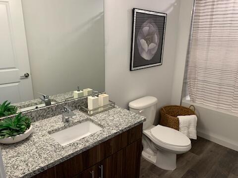 4290 Lakewood Road, Unit 101 Lake Worth, FL 33461 - Photo 7 of 13 a bathroom with a granite countertop sink and a mirror