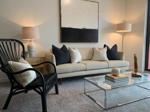 4290 Lakewood Road, Unit 101 Lake Worth, FL 33461 - Photo 10 of 13 a living room with furniture and a lamp