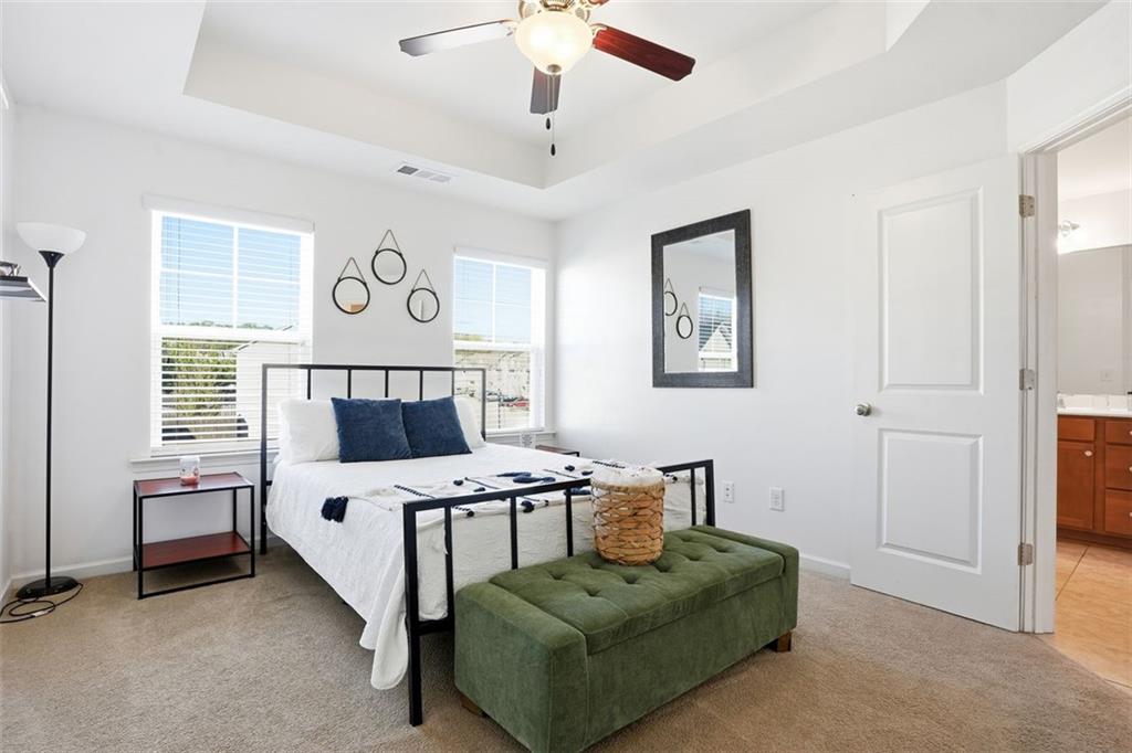 5026 Longview Walk Decatur, GA 30035 - Photo 12 of 31 a bedroom with a bed and a chandelier