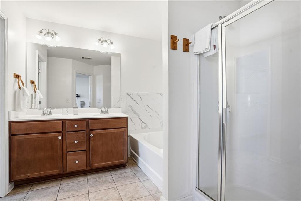 5026 Longview Walk Decatur, GA 30035 - Photo 14 of 31 a bathroom with a double vanity sink mirror and shower