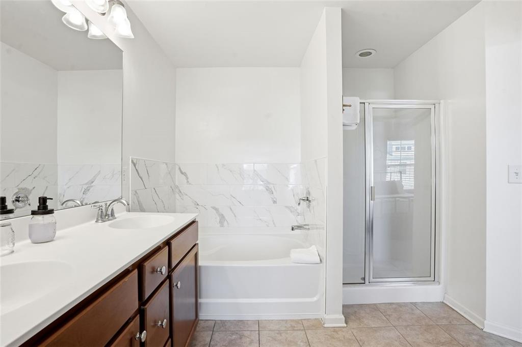 5026 Longview Walk Decatur, GA 30035 - Photo 15 of 31 a bathroom with a sink a toilet and shower