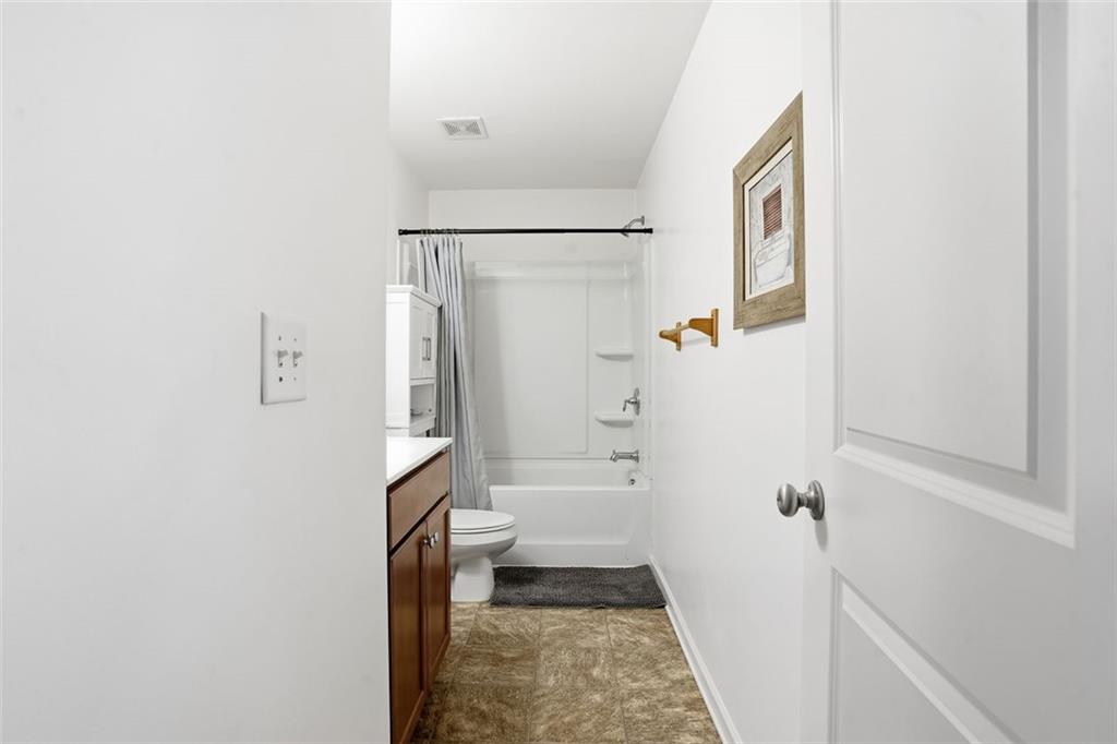5026 Longview Walk Decatur, GA 30035 - Photo 17 of 31 a bathroom with a bathtub and shower