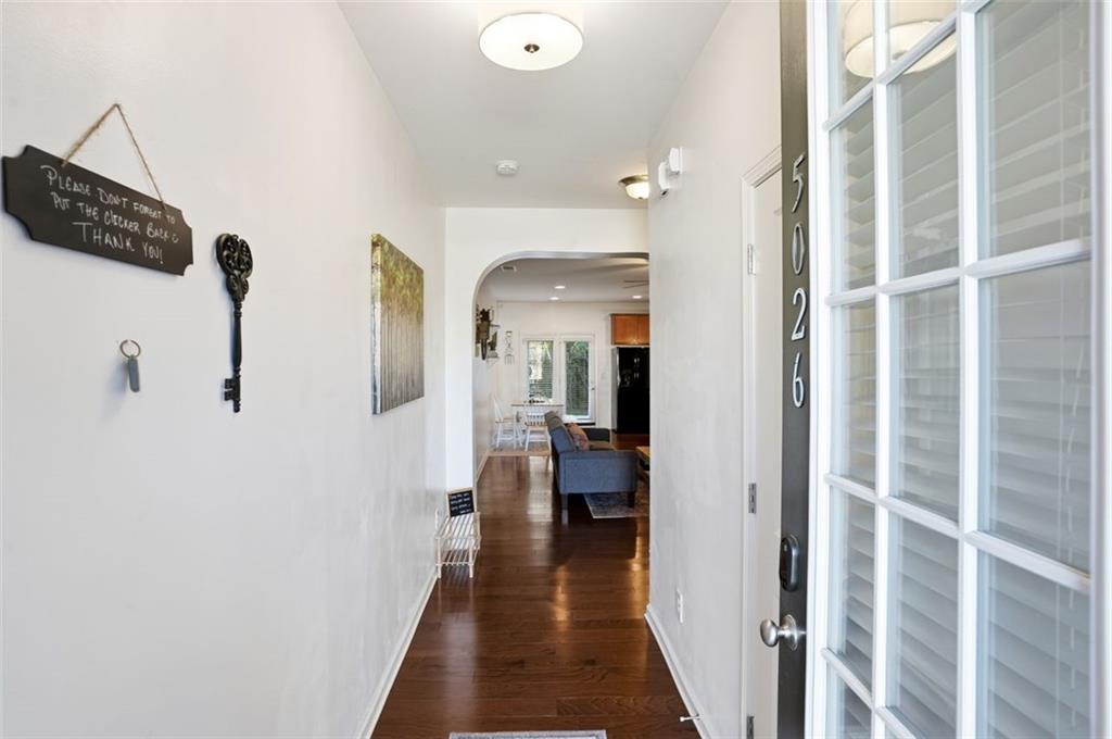 5026 Longview Walk Decatur, GA 30035 - Photo 2 of 31 a view of a hallway with wooden floor and staircase