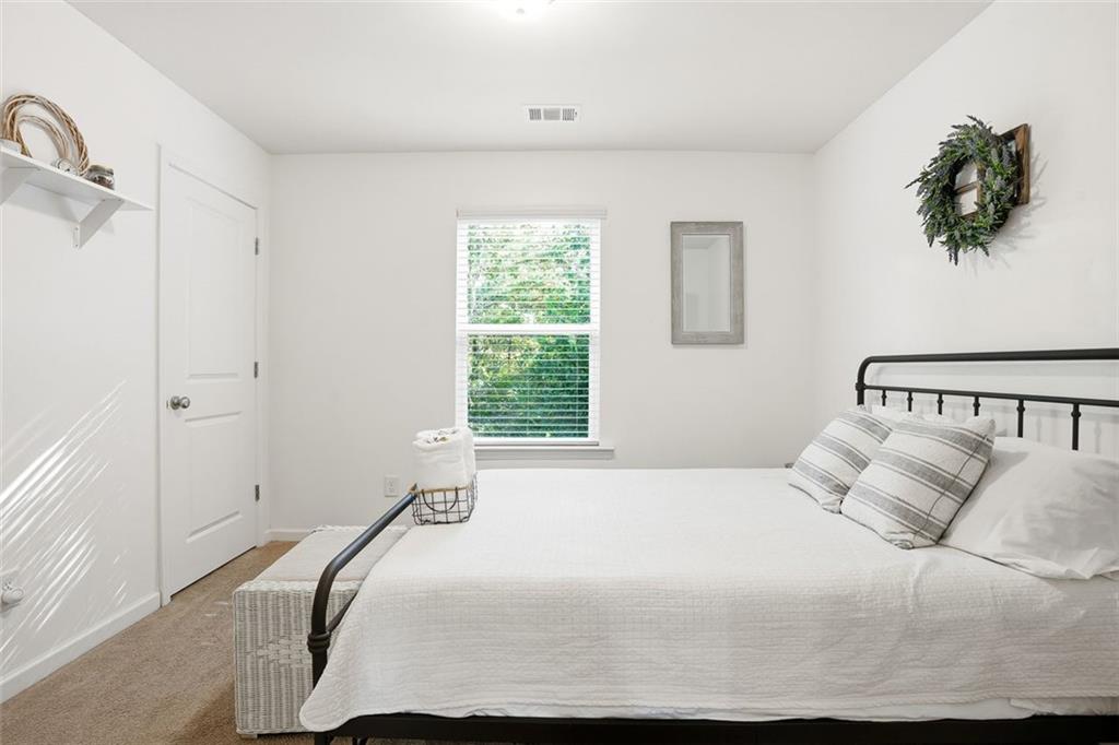 5026 Longview Walk Decatur, GA 30035 - Photo 21 of 31 a bedroom with a bed and a window