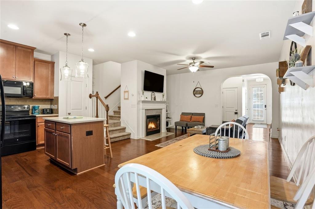 5026 Longview Walk Decatur, GA 30035 - Photo 5 of 31 a kitchen with stainless steel appliances kitchen island granite countertop a sink and a refrigerator