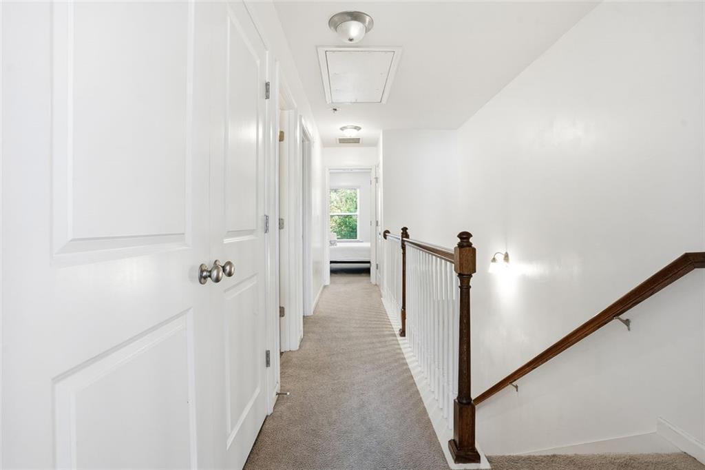5026 Longview Walk Decatur, GA 30035 - Photo 10 of 31 a view of a hallway with wooden floor and staircase