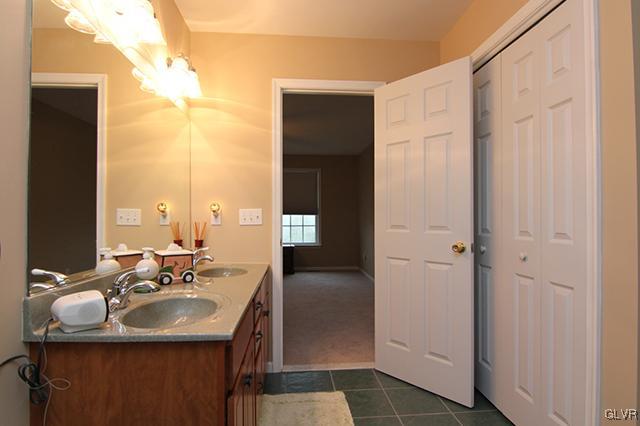 4144 Walter Road Bethlehem, PA 18020 - Photo 13 of 46 a bathroom with a sink double vanity and a mirror