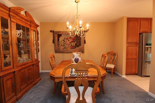 4144 Walter Road Bethlehem, PA 18020 - Photo 25 of 46 a view of a dining room with furniture and a chandelier