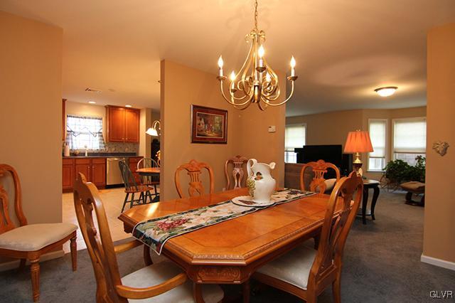 4144 Walter Road Bethlehem, PA 18020 - Photo 26 of 46 a view of a dining room with furniture and chandelier
