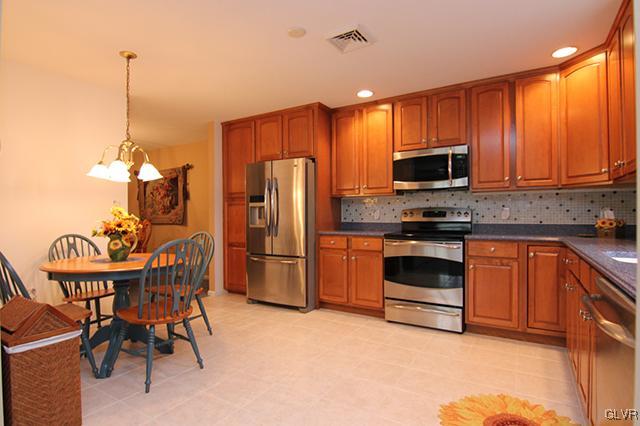 4144 Walter Road Bethlehem, PA 18020 - Photo 33 of 46 a kitchen with stainless steel appliances a stove a sink refrigerator and a microwave