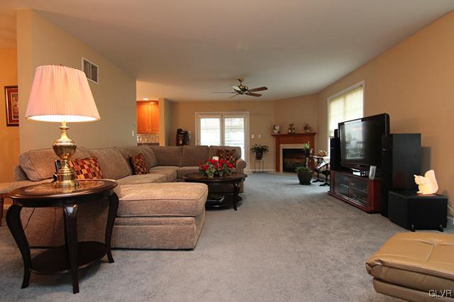 4144 Walter Road Bethlehem, PA 18020 - Photo 4 of 46 a living room with furniture a lamp and a flat screen tv