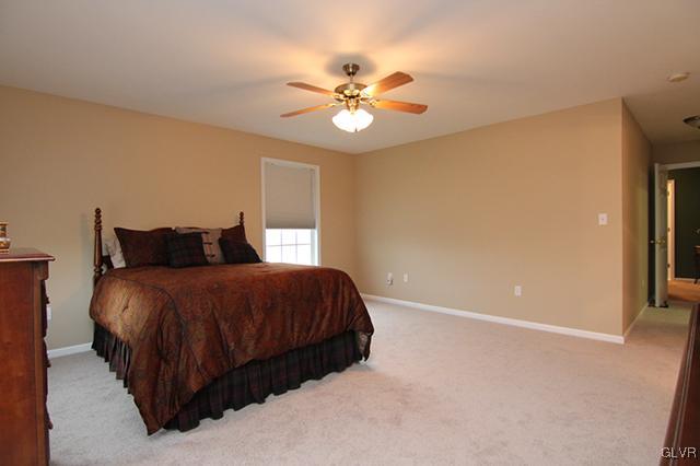 4144 Walter Road Bethlehem, PA 18020 - Photo 9 of 46 a bedroom with a bed and a ceiling fan