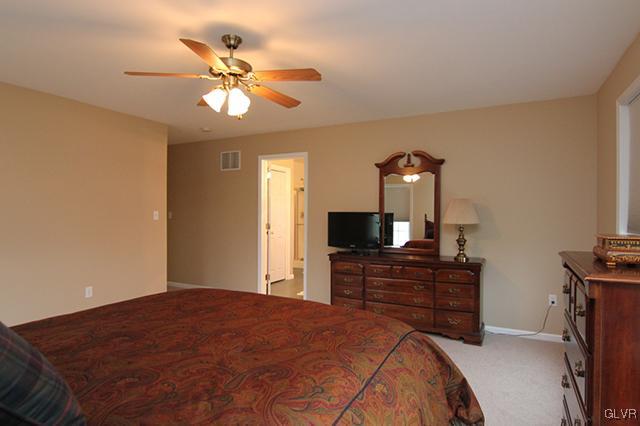 4144 Walter Road Bethlehem, PA 18020 - Photo 10 of 46 a bedroom with a bed and a flat tv screen on dresser