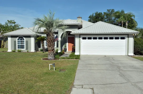 a kitchen with stainless steel appliances a refrigerator stove and sink