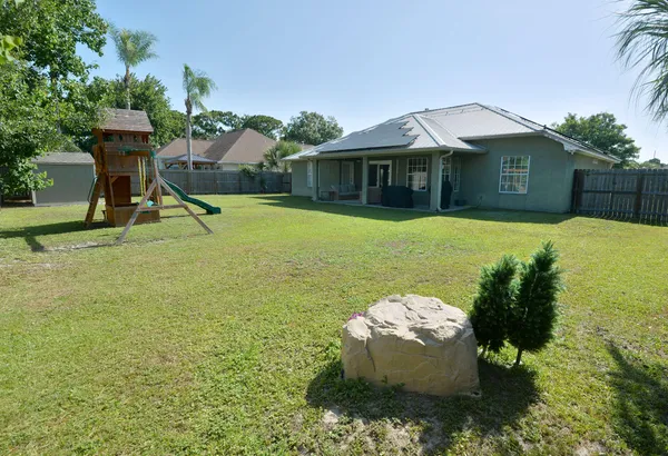 a bedroom with a bed and a dresser in it