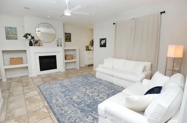 a living room with furniture and a large window