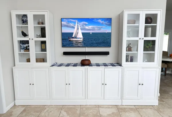 a spacious bathroom with double vanity a mirror and a sink