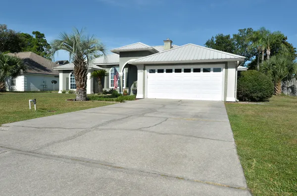 a kitchen with wooden cabinets and stainless steel appliances