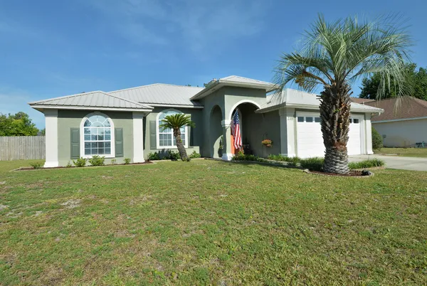 a kitchen with stainless steel appliances granite countertop a refrigerator a stove a sink and a refrigerator