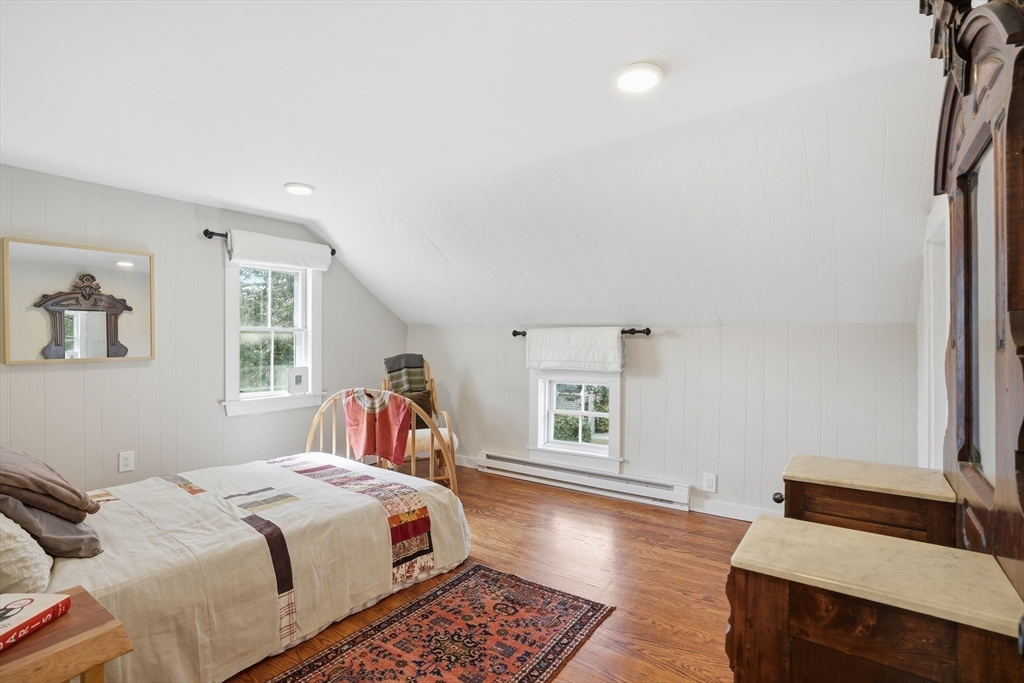 1 North Street Framingham, MA 01701 - Photo 11 of 22 a bedroom with a bed and wooden floor