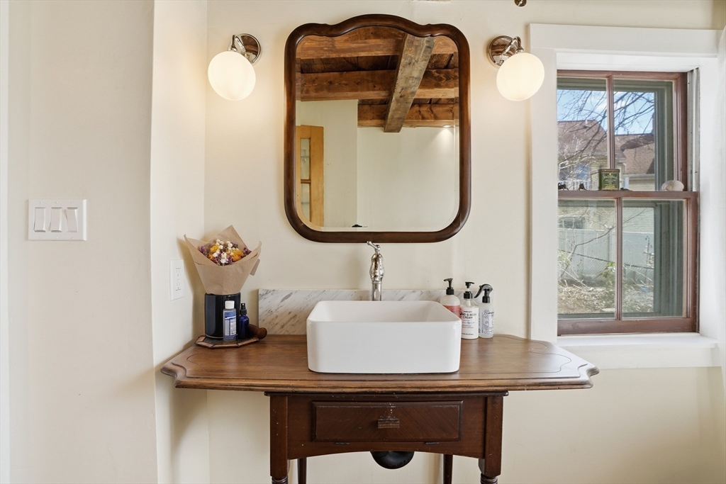1 North Street Framingham, MA 01701 - Photo 10 of 22 a bathroom with a sink and a mirror