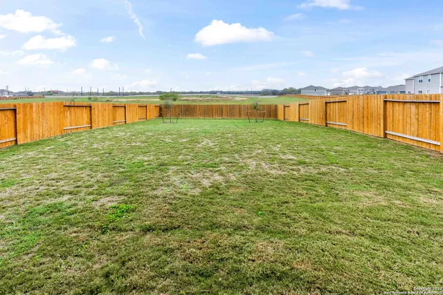 a view of an ocean beach and swimming pool