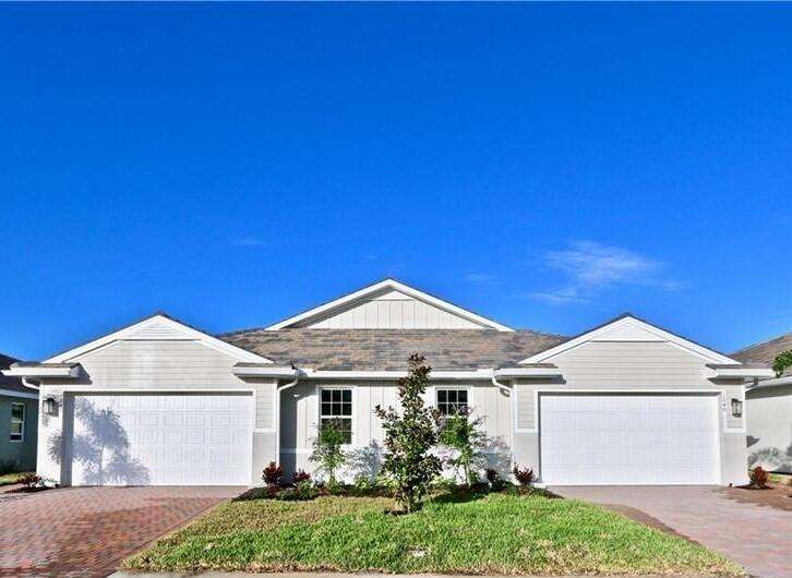 970 Enbrook Loop Naples, FL 34114 - Photo 1 of 1 a front view of a house with garden