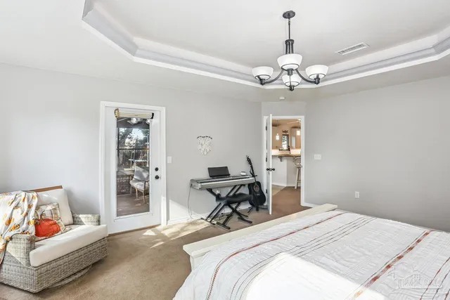 a bedroom with bed and furniture