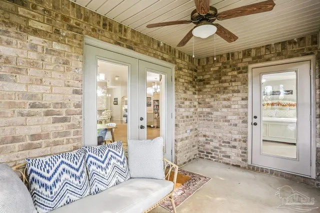 a view of a house with a yard and sitting area