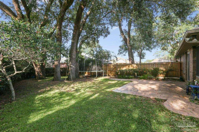 a front view of a house with garden and porch