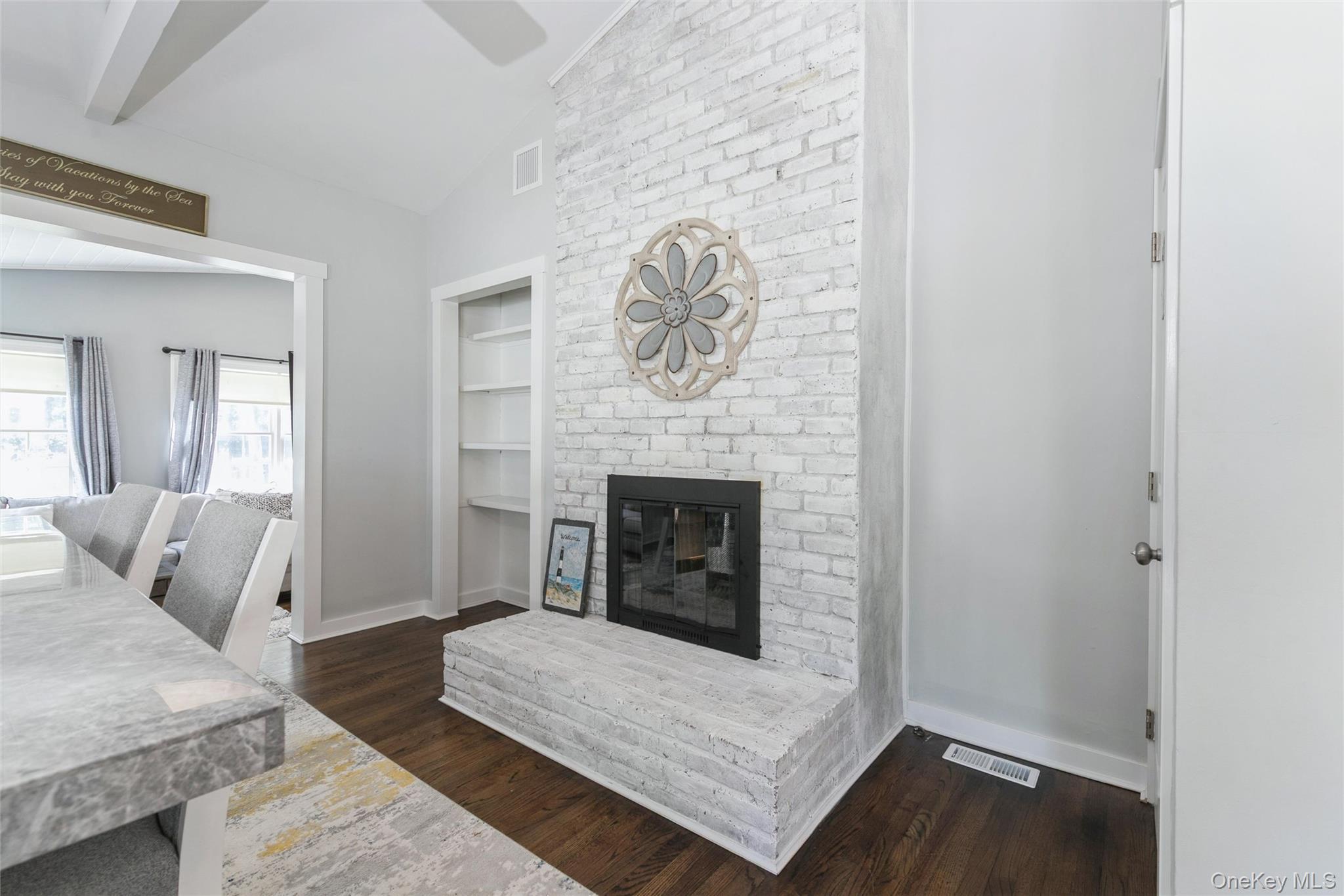 10 Rutland Road East Hampton, NY 11937 - Photo 15 of 47 a living room with furniture and a fireplace