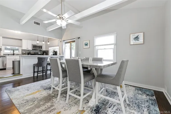 a view of a dining room with furniture