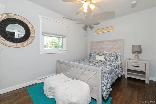 a bedroom with a bed and a chair