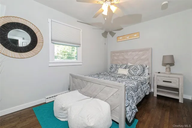 a bedroom with a bed and a chair