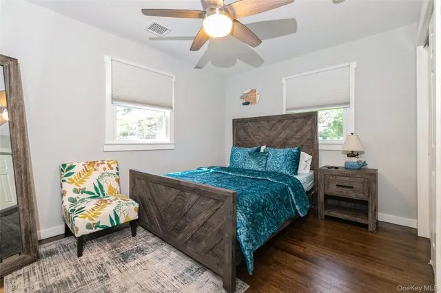 a bedroom with a bed and a couch